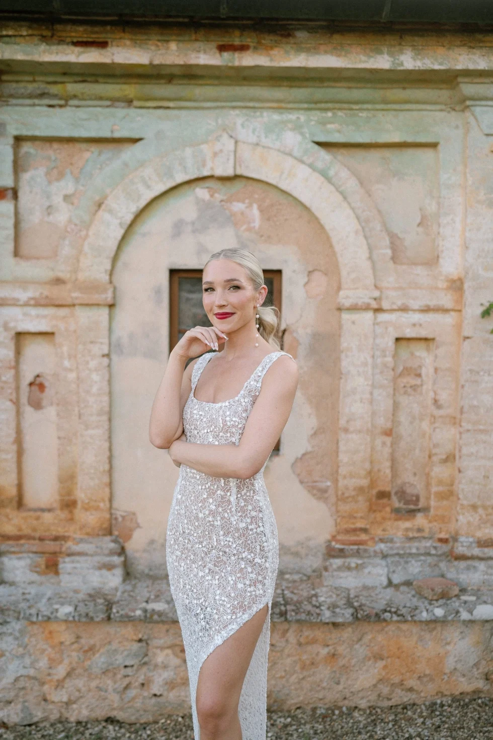 Morgan by the ancient stone walls of Castello di Celsa, Tuscany