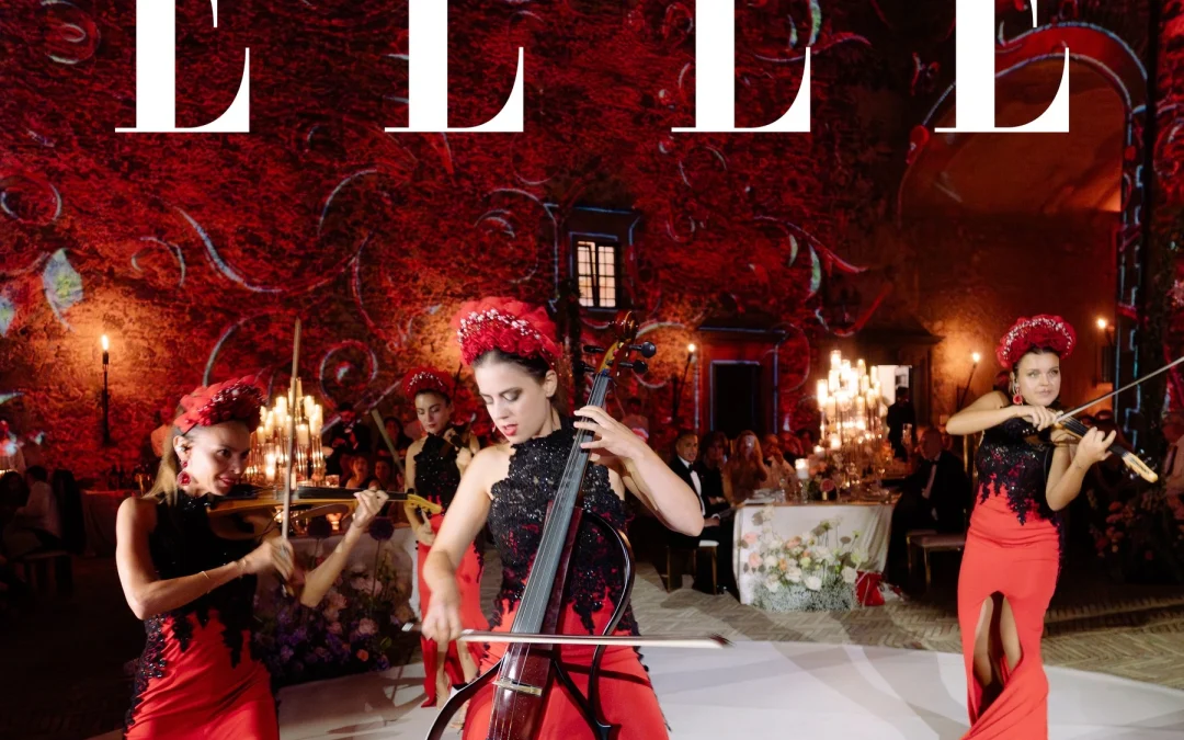 ELLE cover: string musicians in red performing in the illuminated courtyard of Castello Odescalchi at Roxana and Kyle's wedding