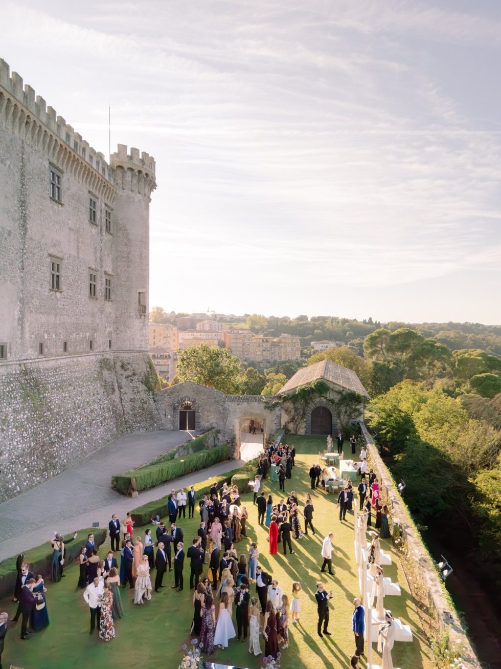 Aerial view of the towers of Castello Odescalchi and the wedding guests on the terrace, Bracciano