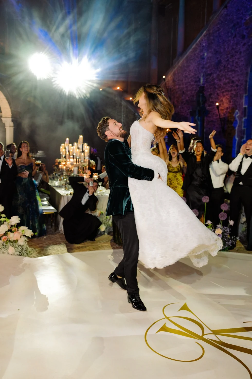 Roxana and Kyle sharing their first dance under the lights of Castello Odescalchi