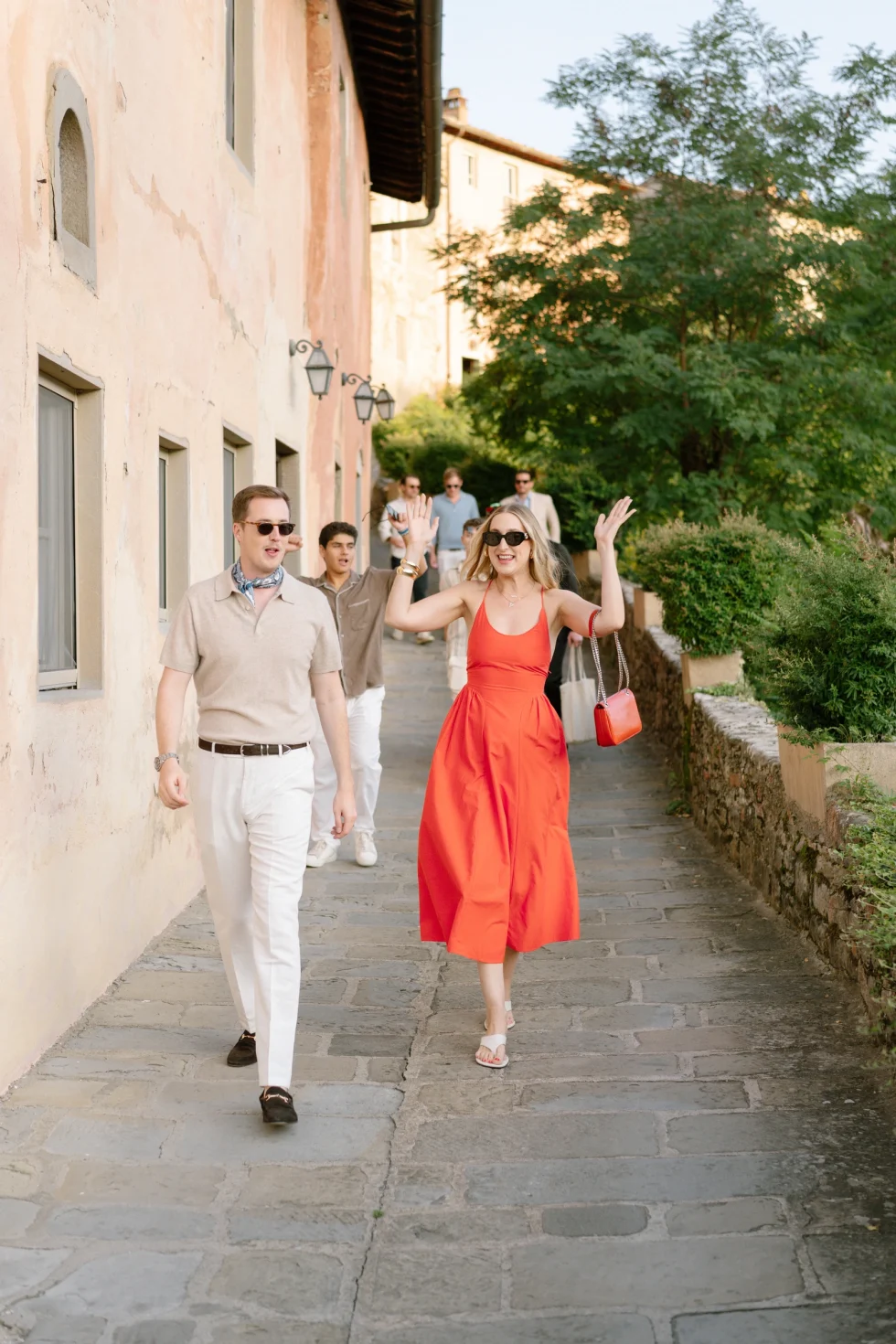 Guests arriving along the stone lane of the medieval village of Il Borro
