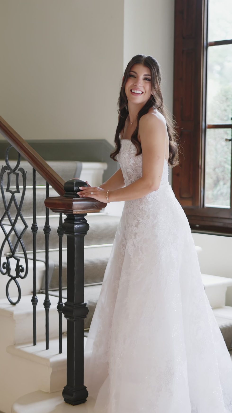The bride on the staircase of the villa at Il Borro, Tuscany