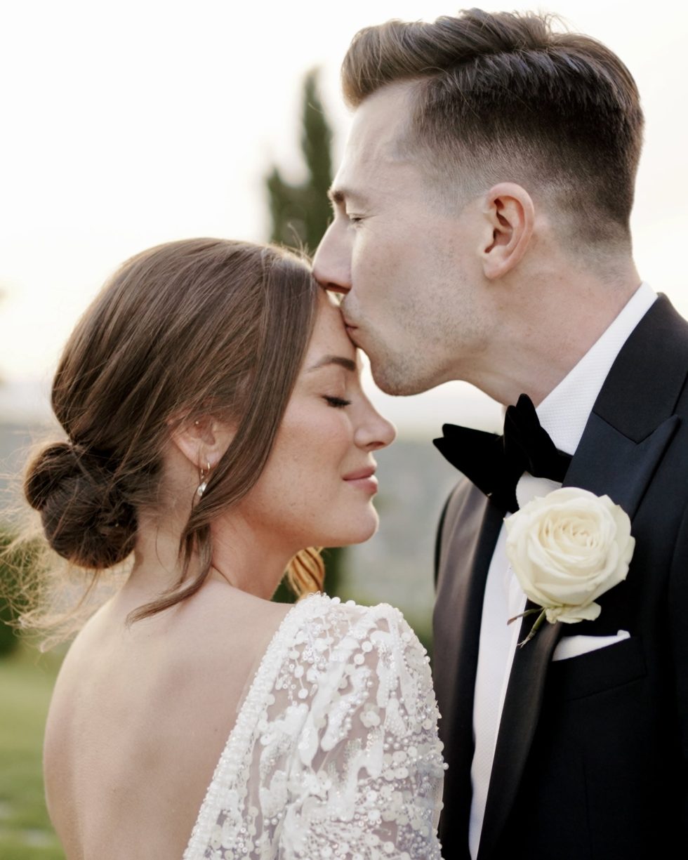 A bride and groom embracing on their wedding day