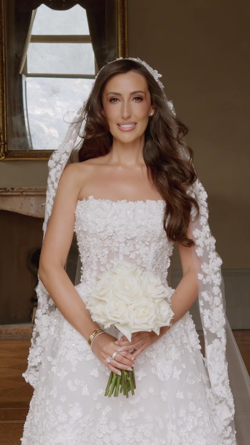 The bride with her white bouquet and lace veil at Villa Erba, Lake Como
