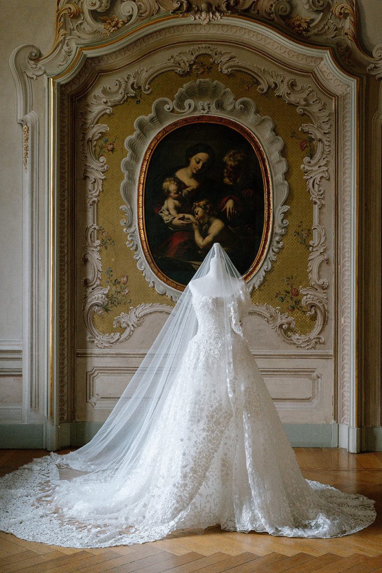 Bride in a cathedral veil beneath a gilded fresco at Villa Erba, Lake Como