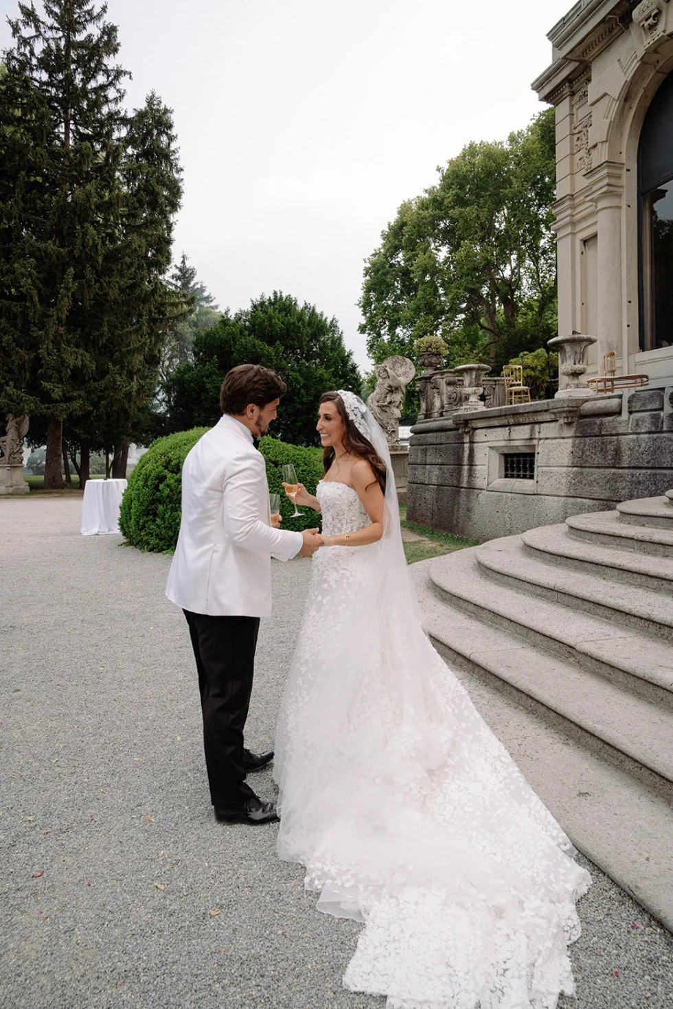 Bride and groom meeting by the steps of Villa Erba before the ceremony, Lake Como