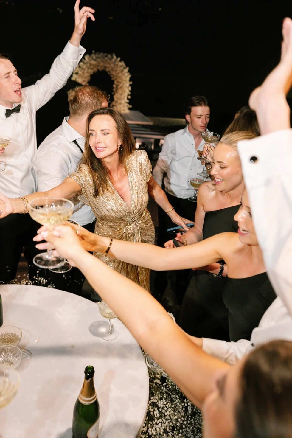 Guests toasting with champagne at the Villa Erba wedding reception, Lake Como