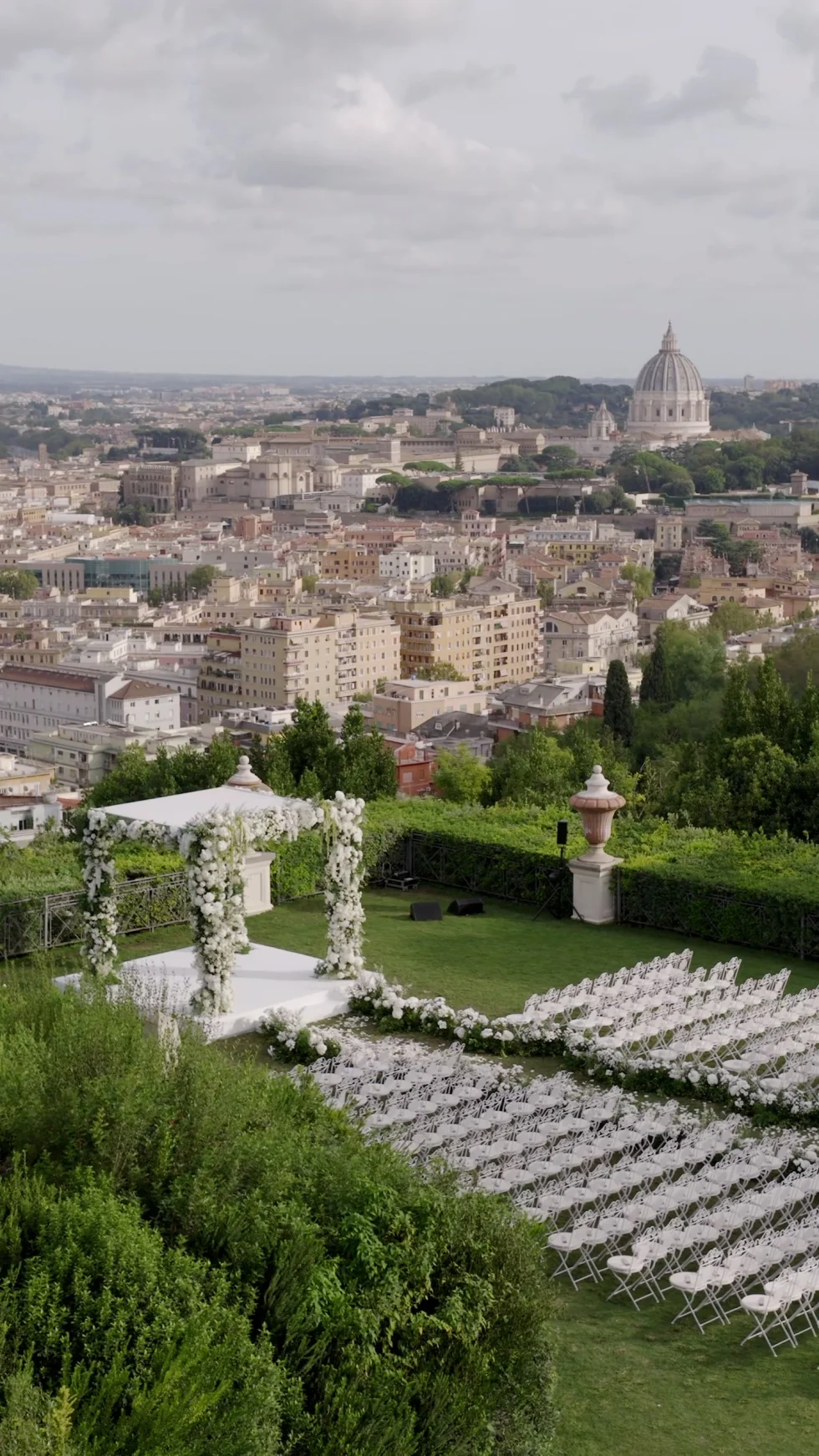 The wedding ceremony set on the lawn of Villa Miani overlooking Rome and St. Peter's