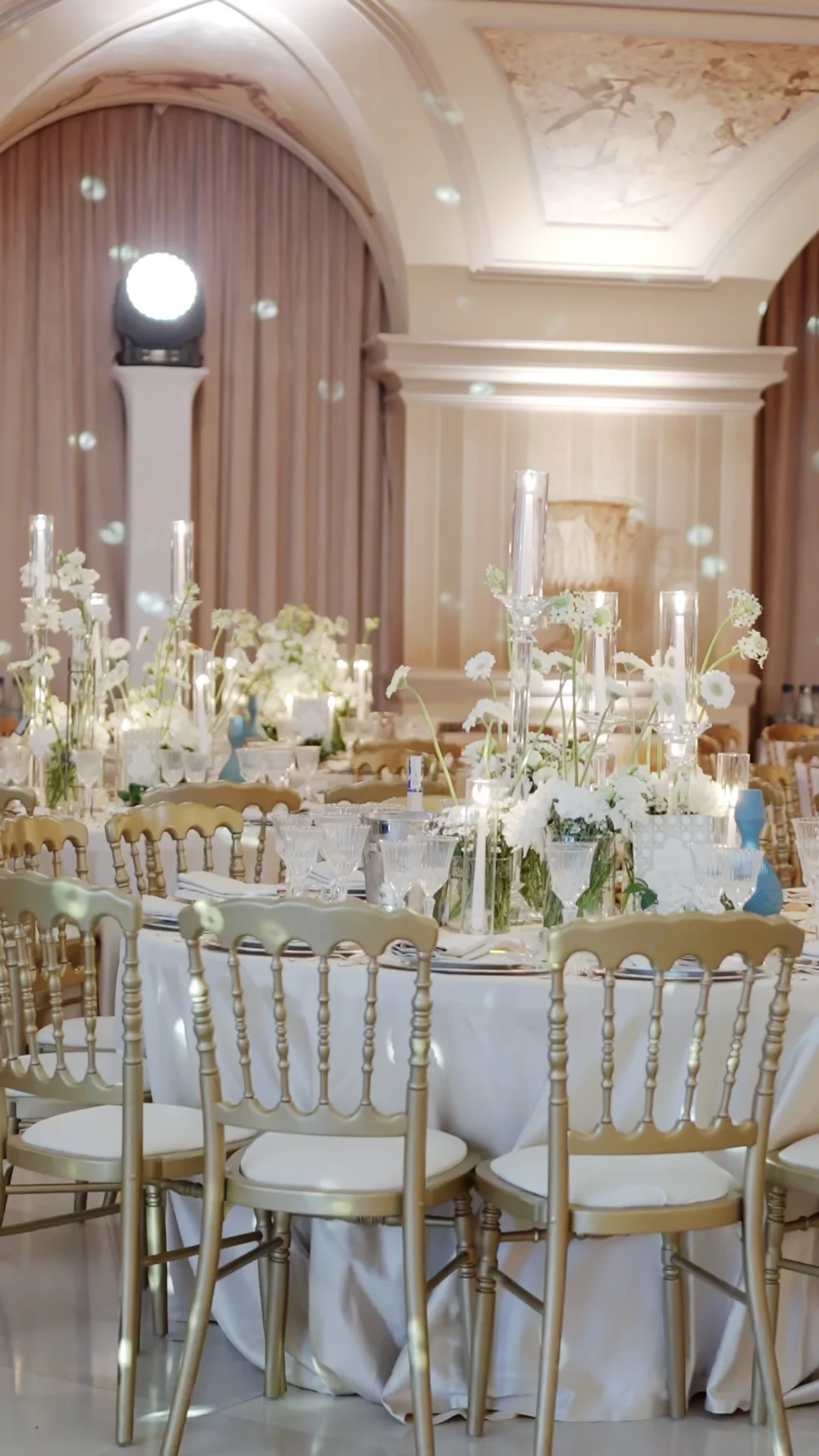 The candlelit reception tables in the ballroom of Villa Miani