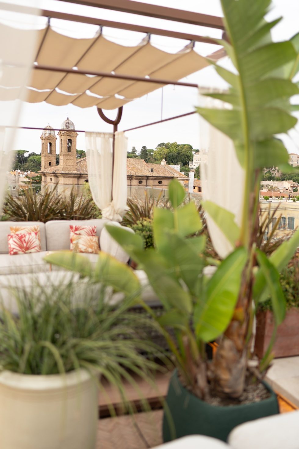 The private terrace of the Presidential Suite at the Bulgari Hotel Roma, overlooking the rooftops of Rome