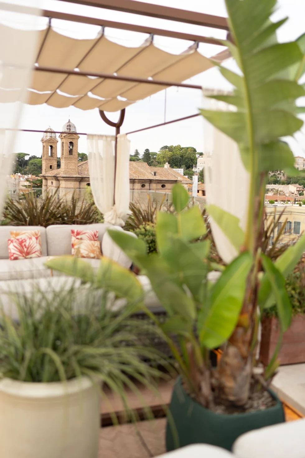 The private terrace of the Presidential Suite at the Bulgari Hotel Roma, overlooking the rooftops of Rome