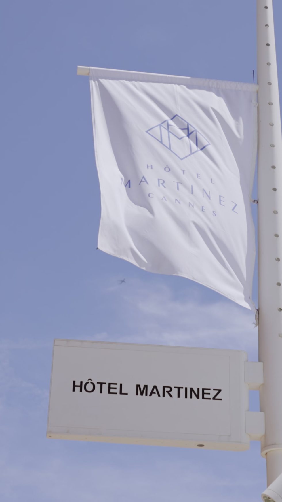 The flag of the Hôtel Martinez against the blue sky of Cannes