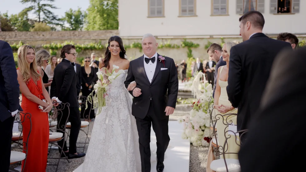 Jenna walking down the aisle with her father at Villa Corsini, Florence