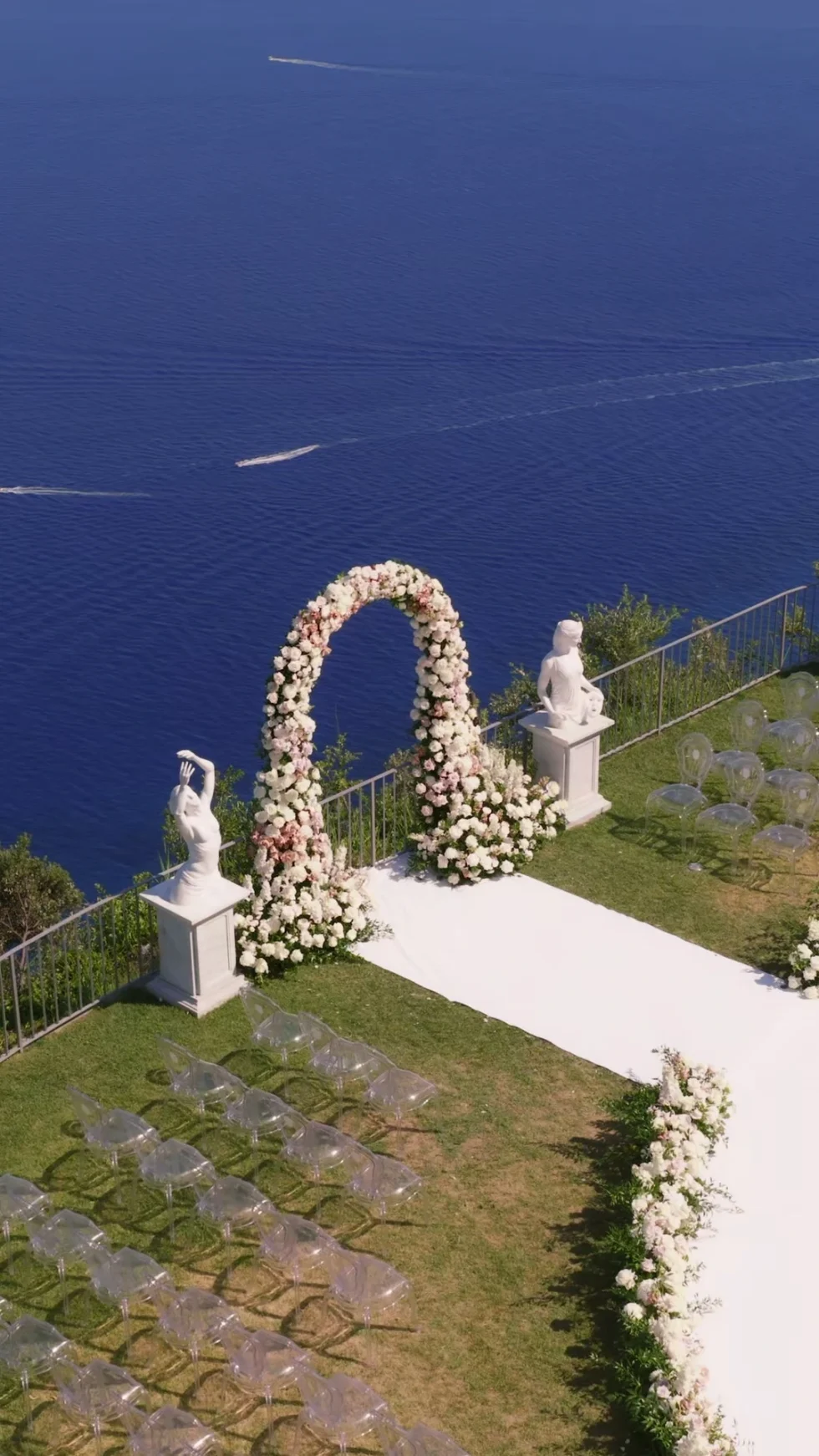 The floral ceremony arch overlooking the sea at La Rondinaia, Ravello