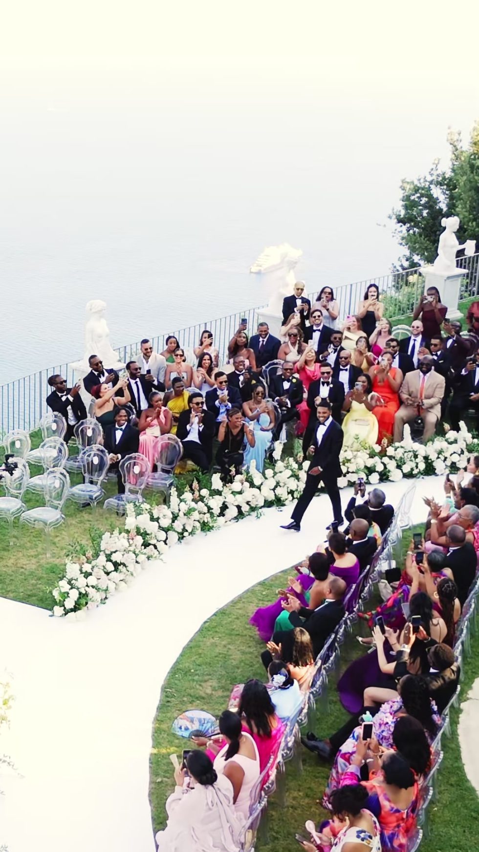 Guests gathered for the ceremony in the gardens of La Rondinaia, seen from above