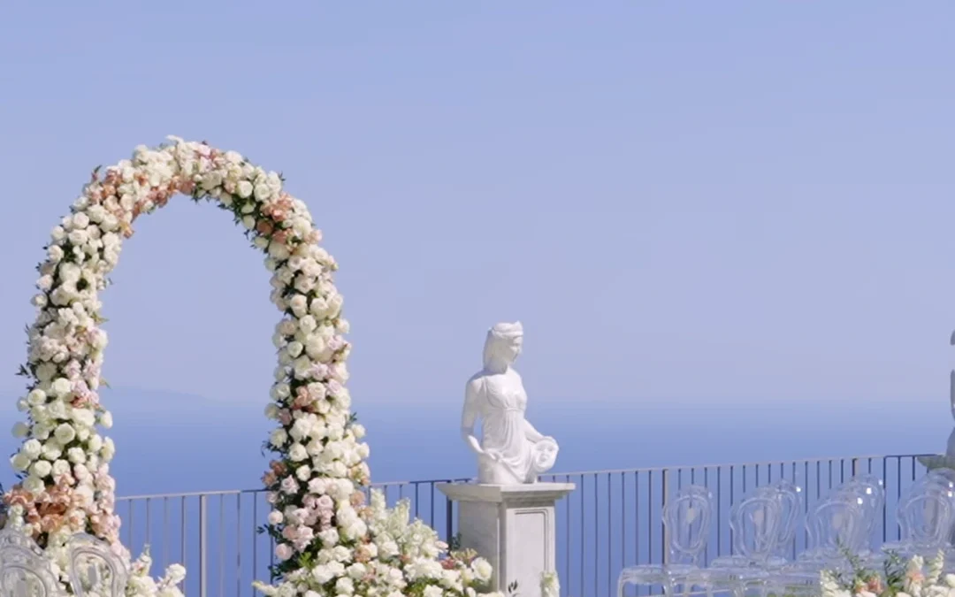 The floral ceremony arch facing the sea on the terrace of La Rondinaia, Ravello
